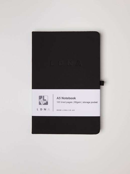 LDNA London black notebook against white background.